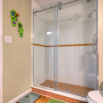 Shower with glass enclosure