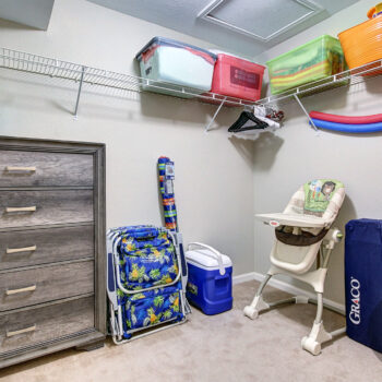 Walk-in closet: High chair, Pack'n Play Playard/ Chairs, Cooler and Umbrella