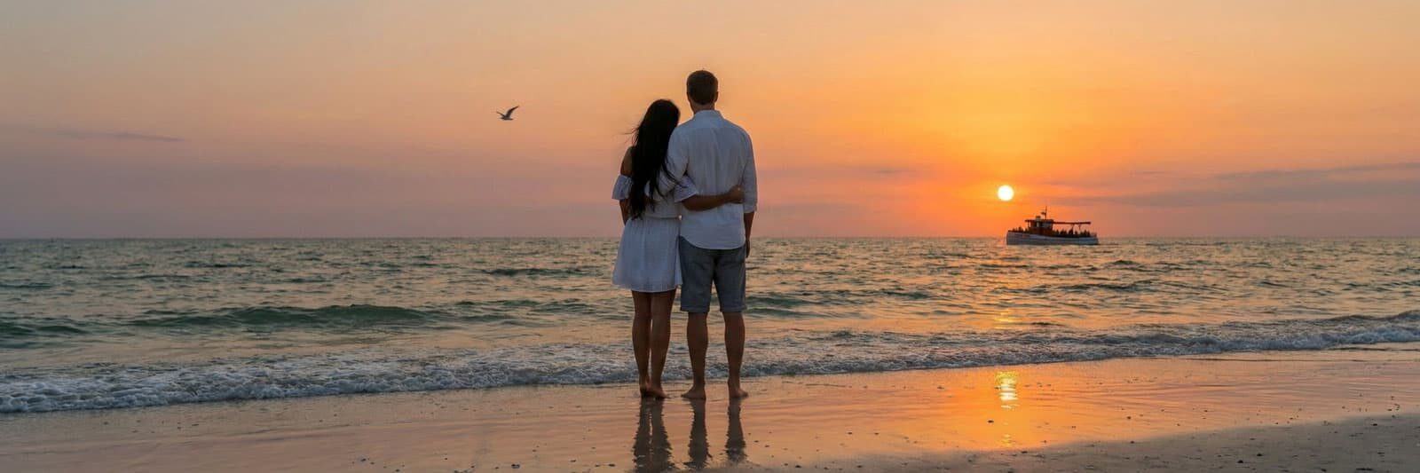 Couple watching the sunset on the beach in Clearwater