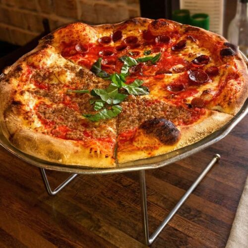 Half pepperoni and half sausage pizza at Cristino’s in Clearwater