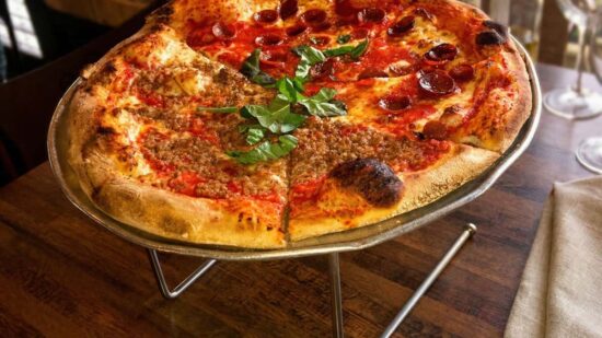 Half pepperoni and half sausage pizza at Cristino’s in Clearwater